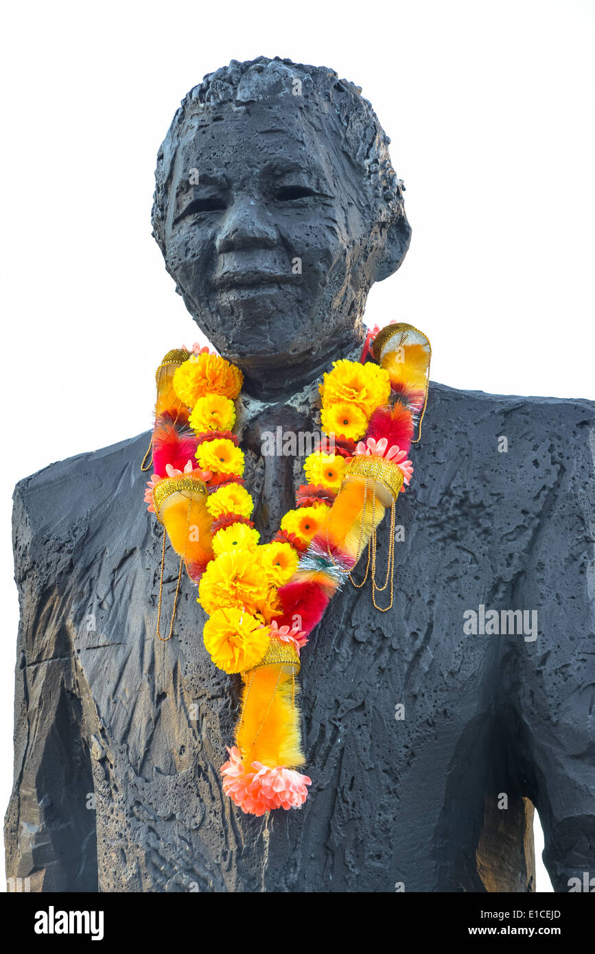 flowers at the statue of nelson mandela the day he deceased Stock Photo