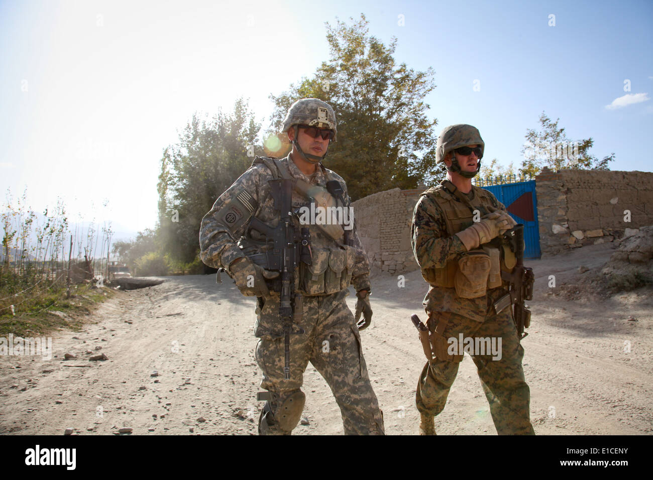 U.S. Army Lt. Col. Kimo Gallahue and Marine Corps Lt. Col. Paul Brickley conduct a joint patrol in the Wardak province of Afgha Stock Photo