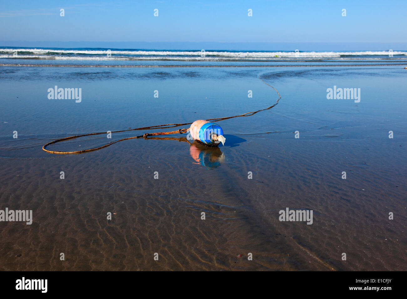 buoy attached to a rope on long beach Stock Photo