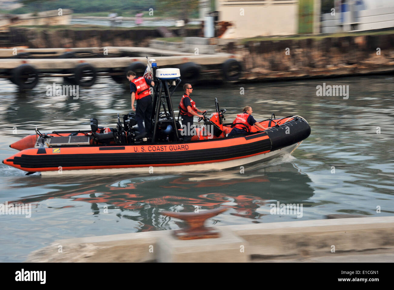 A U.S. Coast Guard boat crew from the Coast Guard Cutter Tahoma arrives ...
