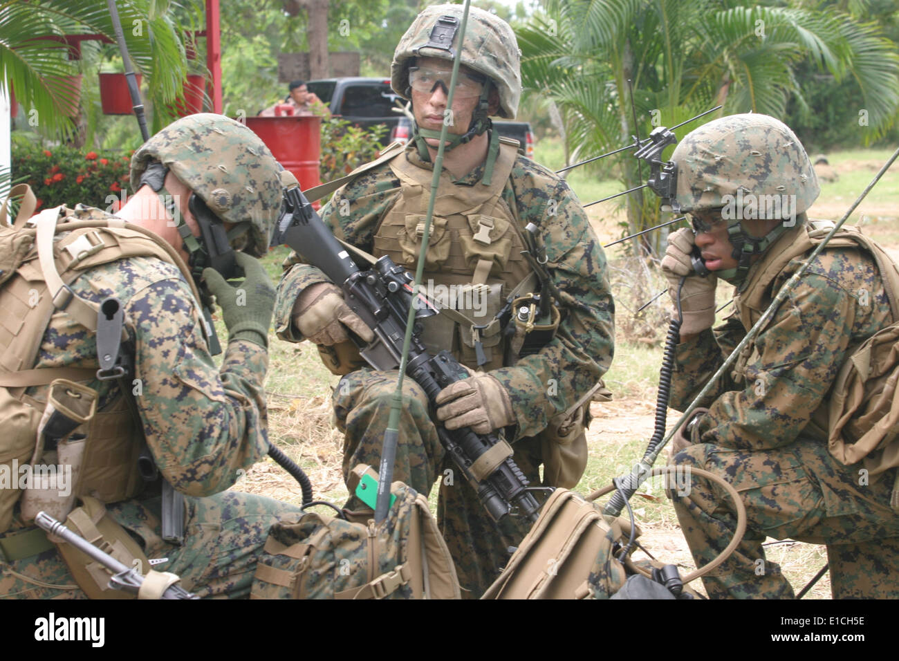 U.S. Marine Corps radio operators use communication gear during a mock