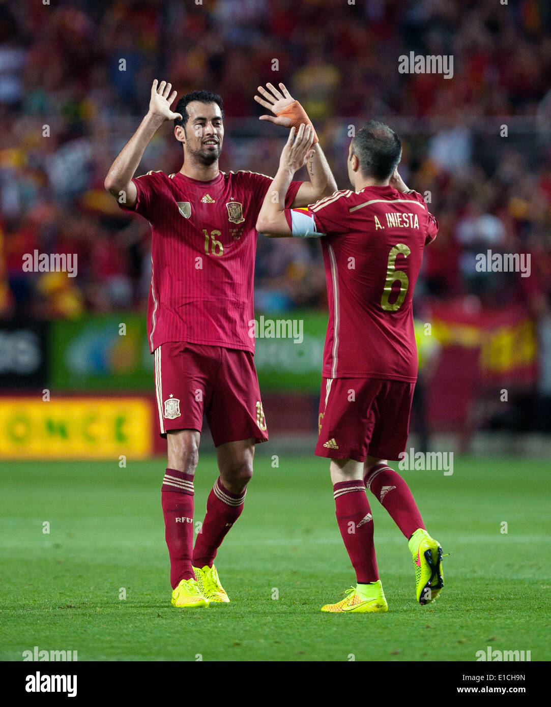 Sevilla. 30th May, 2014. Spain's Andres Iniesta (R) celebrates with teammate after scoring during the international friendly football match against Bolivia in Sevilla on May 30, 2014. Spain won 2-0. © Xie Haining/Xinhua/Alamy Live News Stock Photo