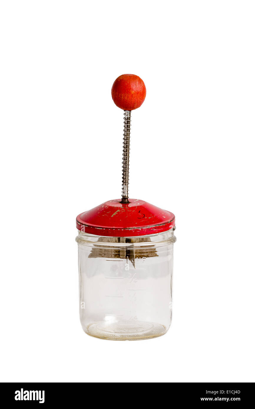 https://c8.alamy.com/comp/E1CJ4D/antique-nut-chopper-with-a-red-handle-with-a-glass-jar-on-a-solid-E1CJ4D.jpg