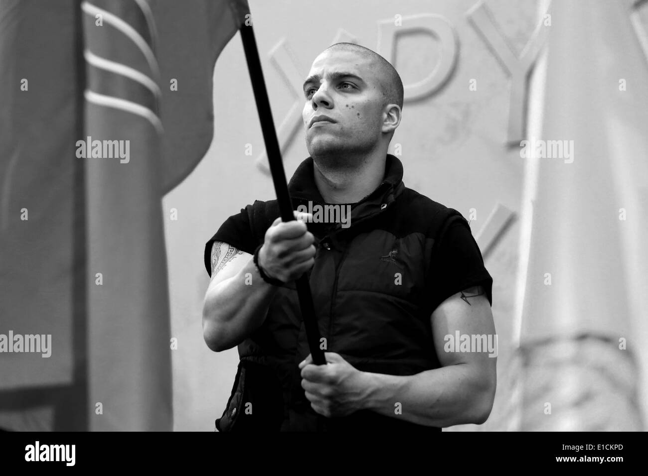 Athens, Attika, Greece. 29th May, 2014. A party member holds a banner during an event organized by the nationalist Golden Dawn party in front of the Athens Cathedral, on the occasion of the anniversary of the fall of Constantinople to the Turks, on May 1453. In central Athens on May 29, 2014 © Panayiotis Tzamaros/NurPhoto/ZUMAPRESS.com/Alamy Live News Stock Photo