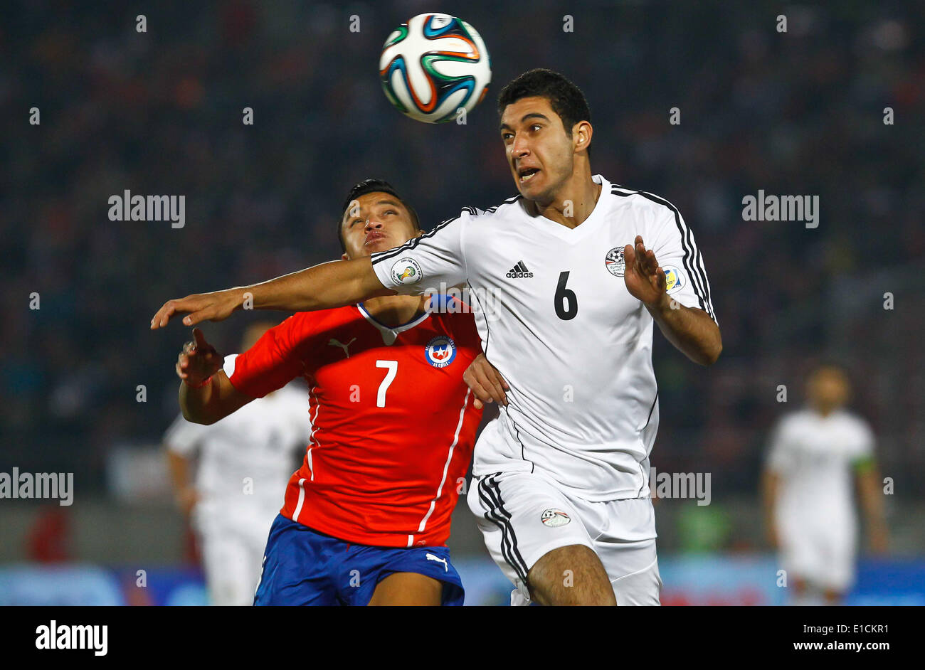 Santiago, Chile. 30th May, 2014. Alexis Sanchez (L) of Chile vies for the  ball with Rami Rabia of Egypt during their international friendly soccer  match in Santiago City, capital of Chile, on