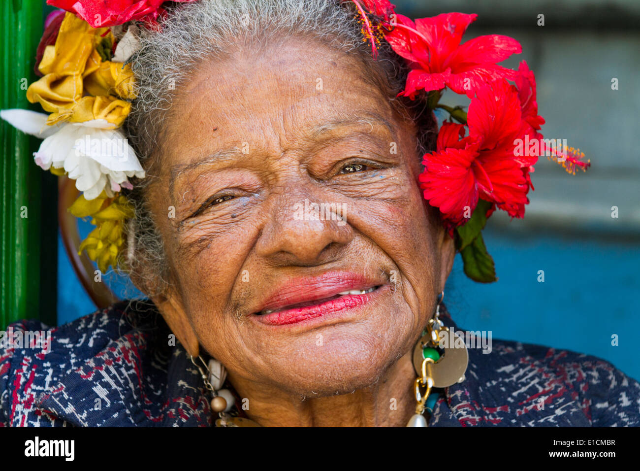 Close up of old Cuban woman happily smiling in the late afternoon sun in Havana Old Town Stock Photo