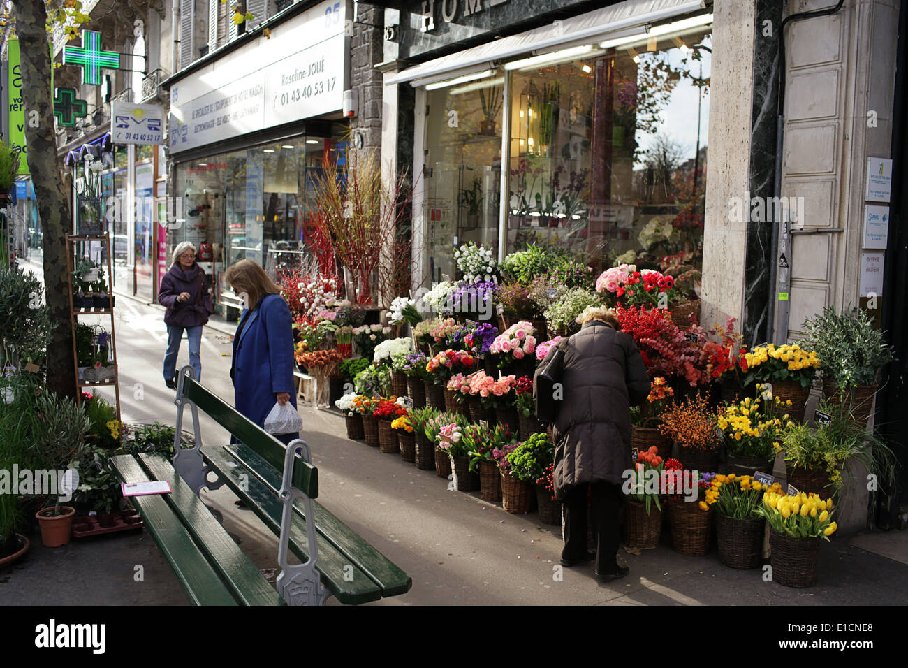 Flower seller in a typical street scene in Paris, France Stock Photo