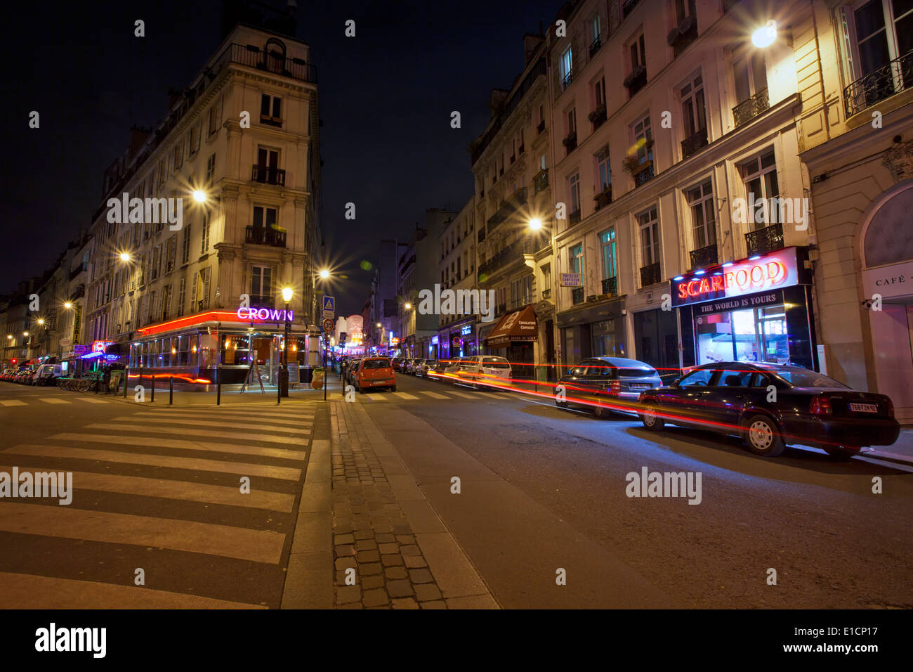A quiet street scene at night in Paris, France Stock Photo