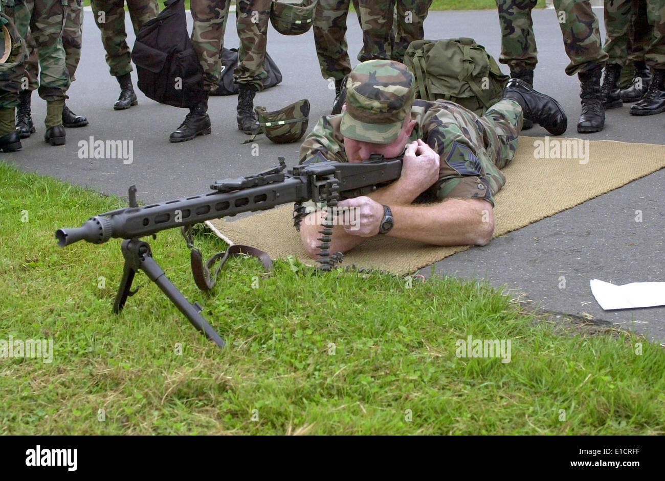 An airman receives hands on training with a German MG42 machine gun, Sembach, Germany. 8/10/2002. Stock Photo