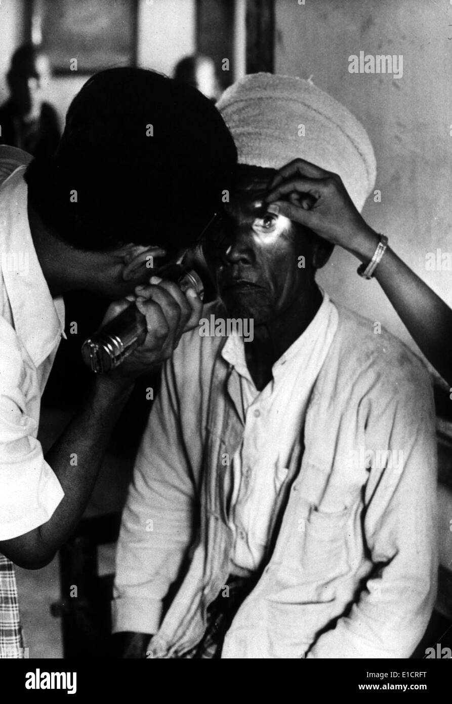 Trachoma. An old man with Trachoma is having his eyes examined.  WHO photo by N. Willard. ND Stock Photo