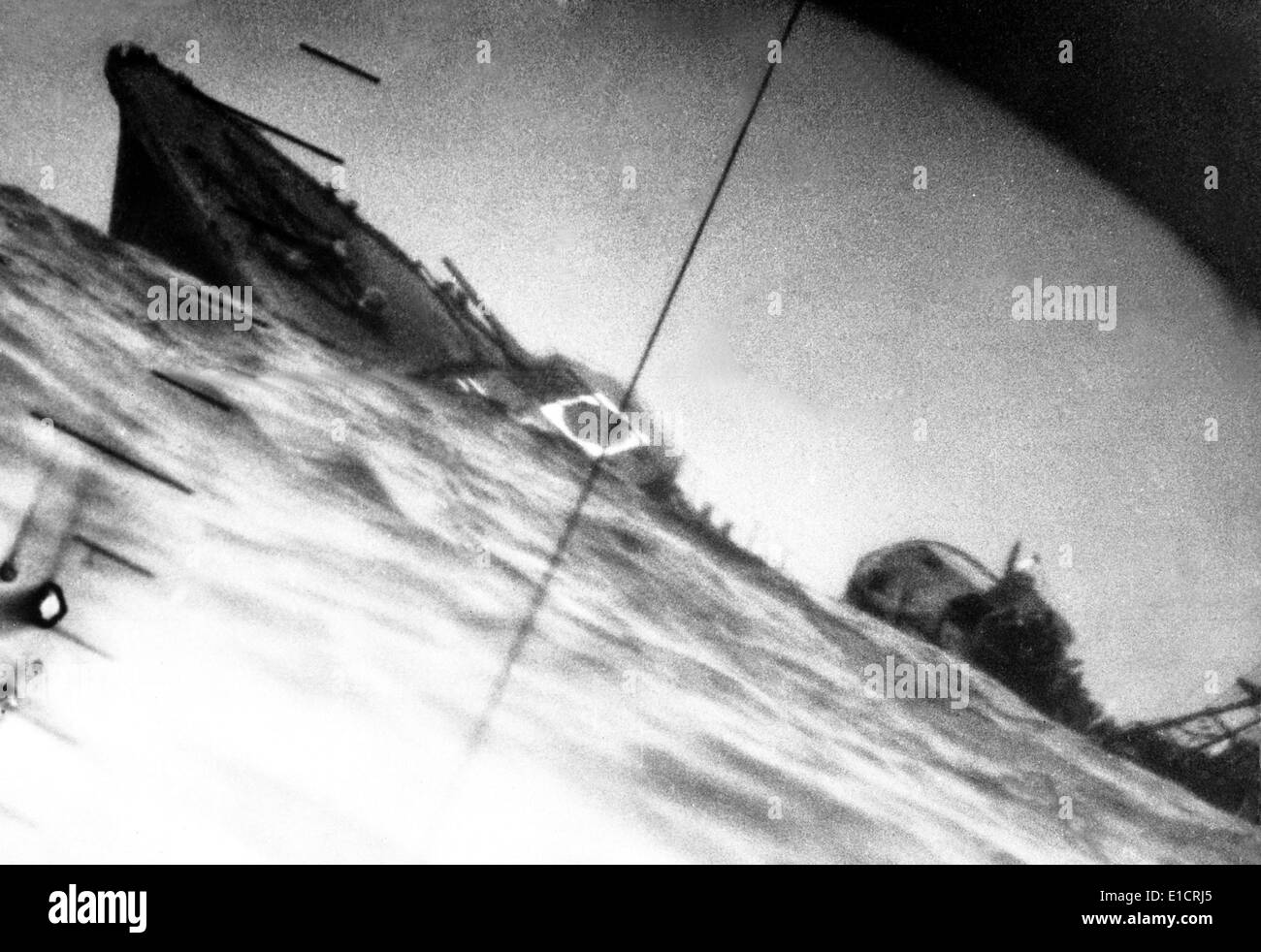 Torpedoed Japanese destroyer seen through periscope of USS Wahoo or USS Nautilus during World War 2. June 1942. Stock Photo