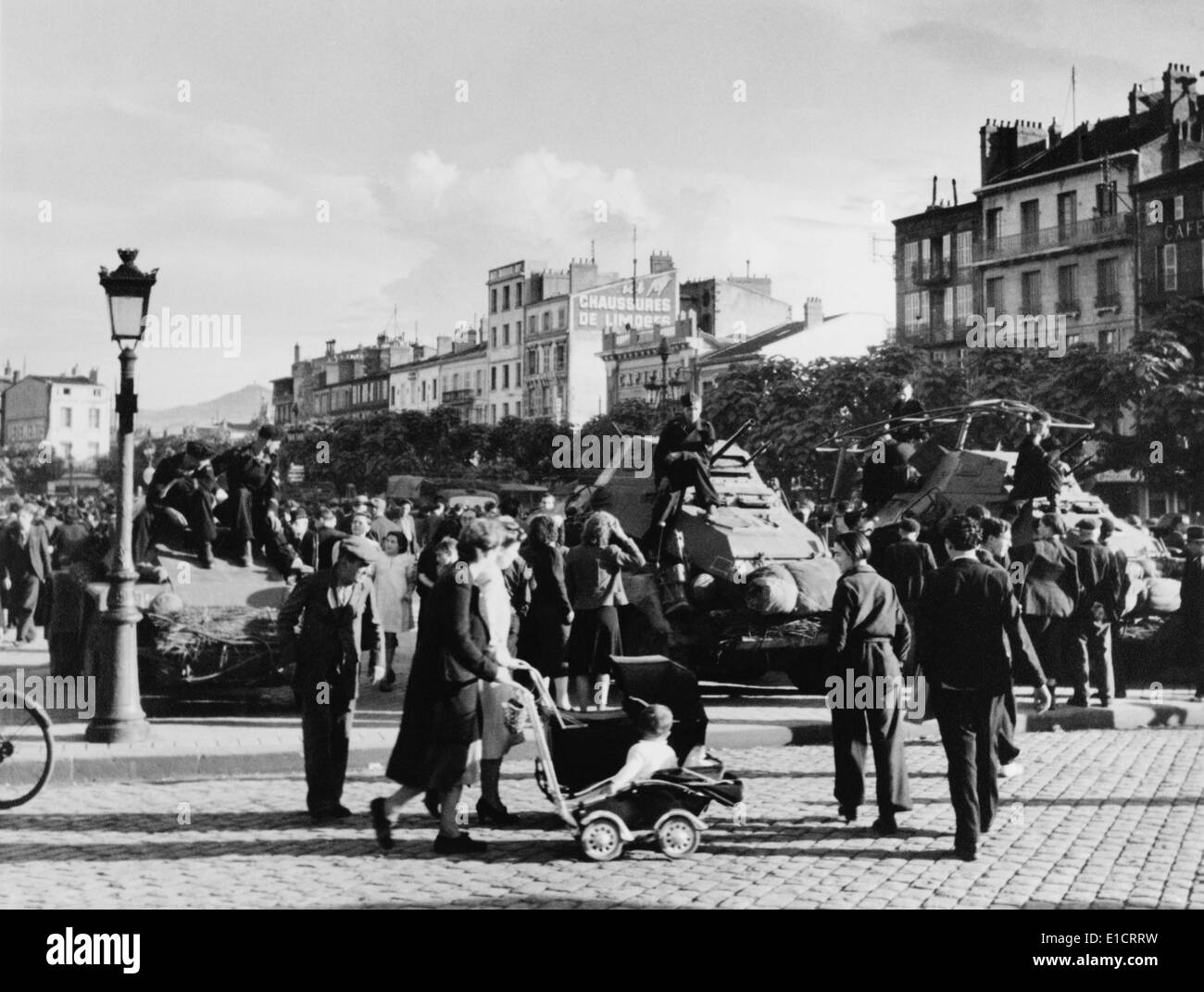 German soldiers with tanks and civilians in occupied Metz, France, ca. June 1940 during World War 2. (BSLOC 2013 11 64) Stock Photo
