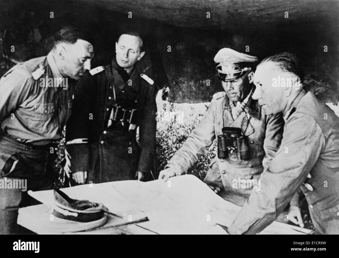 Field Marshal Erwin Rommel confers with his staff on the Libyan front, July 1942. He was fighting the British in the First Stock Photo