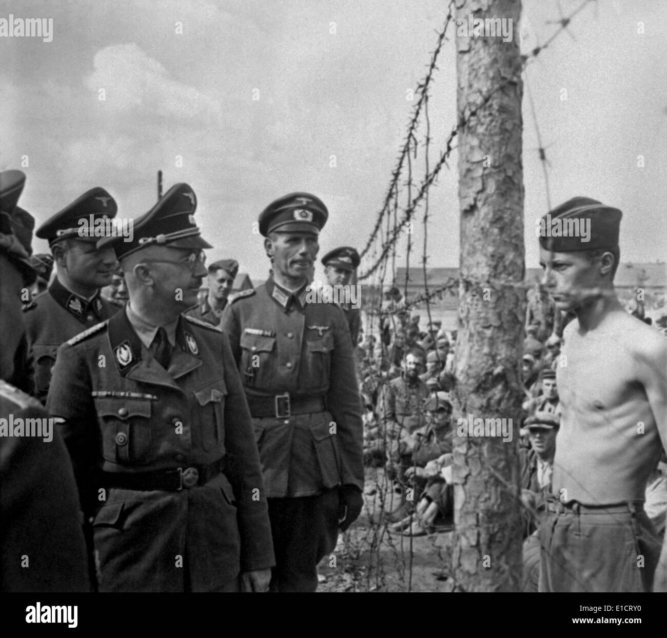 Heinrich Himmler, Head of the Nazi SS, inspects a prisoner-of-war camp in Russia. Among German war crimes was the death from Stock Photo