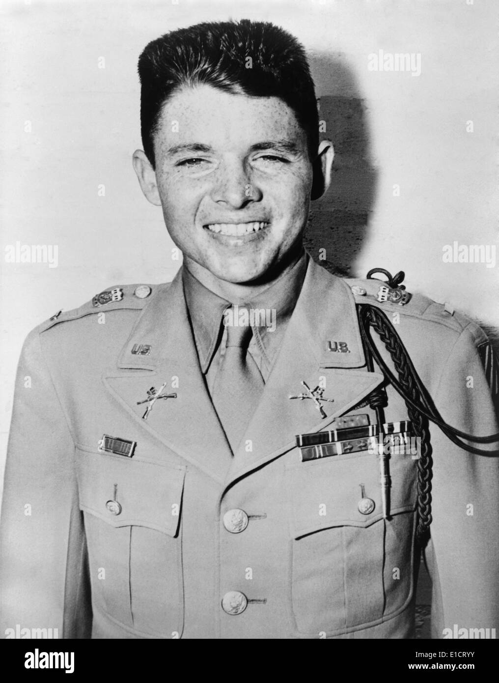 Audie Murphy was one of the most decorated American combat soldiers of World War 2. Afterward, he made 44 films, most Westerns. Stock Photo