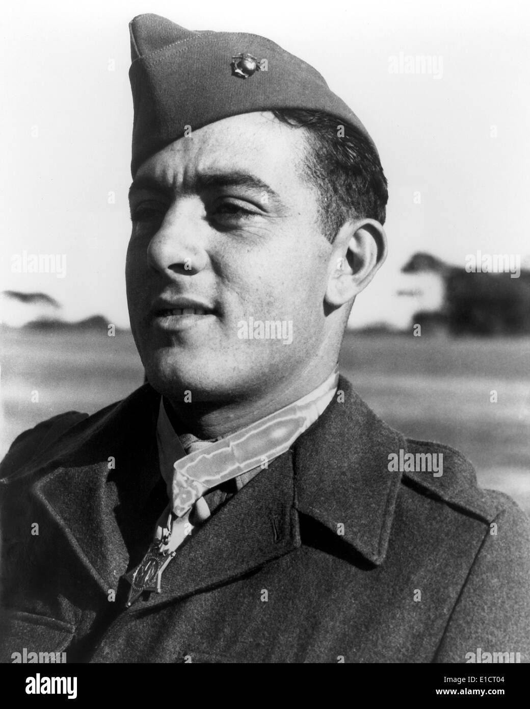 John Basilone, a Marine Gunnery Sergeant with his Medal of Honor, won in the Battle of Guadalcanal. He held off 3,000 Japanese. Portrait ca. 1943 Stock Photo