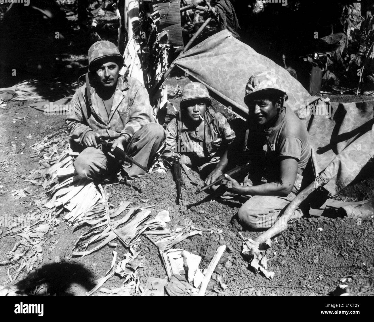 Navajo Code Talkers landed with the first Marine assault waves on Saipan against Japanese. June 1944. WINDTALKERS was a 2002 Stock Photo
