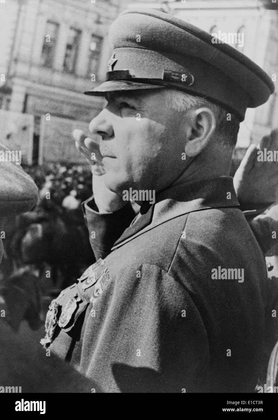 Marshal Zhukov saluting while reviewing a Russian military parade. Unknown location. Ca. 1945. Photo by Georgii Zelma. Stock Photo
