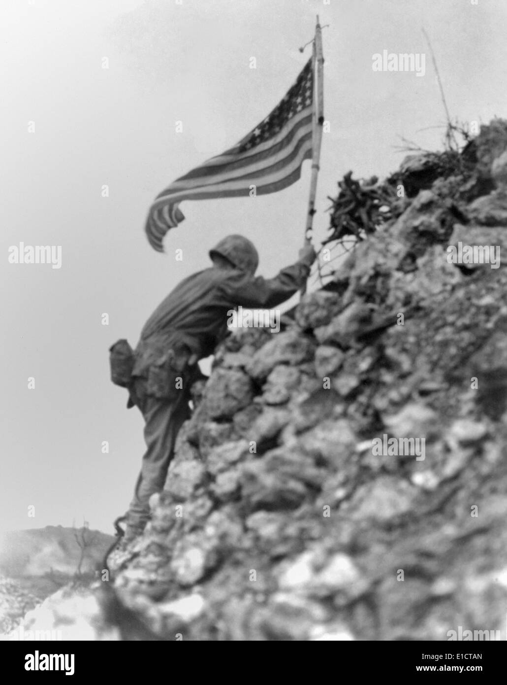 Marine 1st Battalion commander braved sniper fire to place a flag on Shuri Castle, Okinawa. May 30, 1945. The same flag was Stock Photo