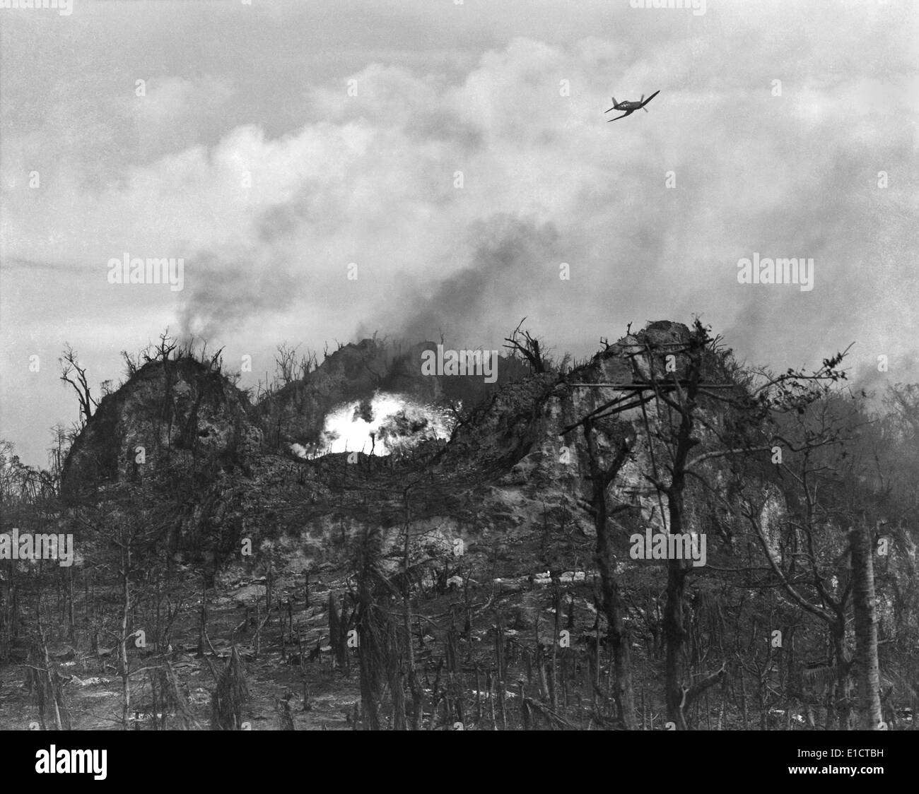 U.S. airplane drop bombs on the enemy area in the hills of Peleliu Island. Sept.-Nov. 1944. World War 2, Pacific Ocean. Stock Photo