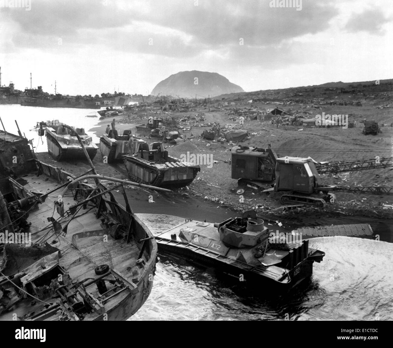 Vehicles of war knocked out on the black sands of the volcanic island of Iwo Jima. They were smashed by Japanese mortar and Stock Photo