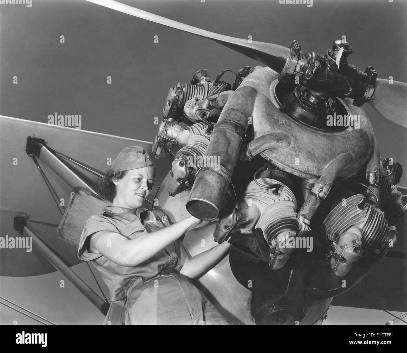 A young women soldier of Women’s Army Corps (WAC) repairing aircraft