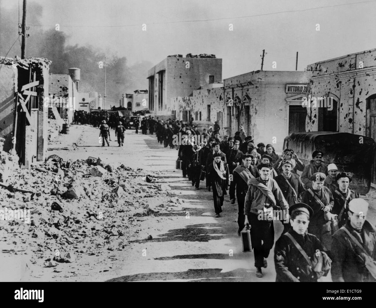 Italian naval prisoners march through Tobruk on their way to a prison ...