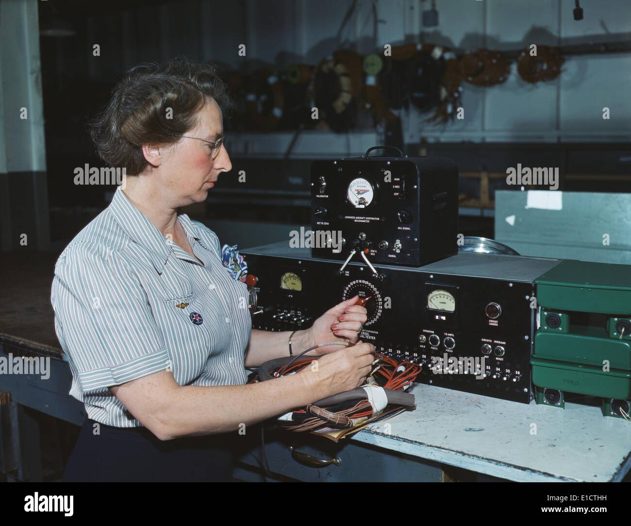 Woman electric wiring technician at Douglas Aircraft Company, Long Beach, California. During World War 2, Oct. 1942. Stock Photo