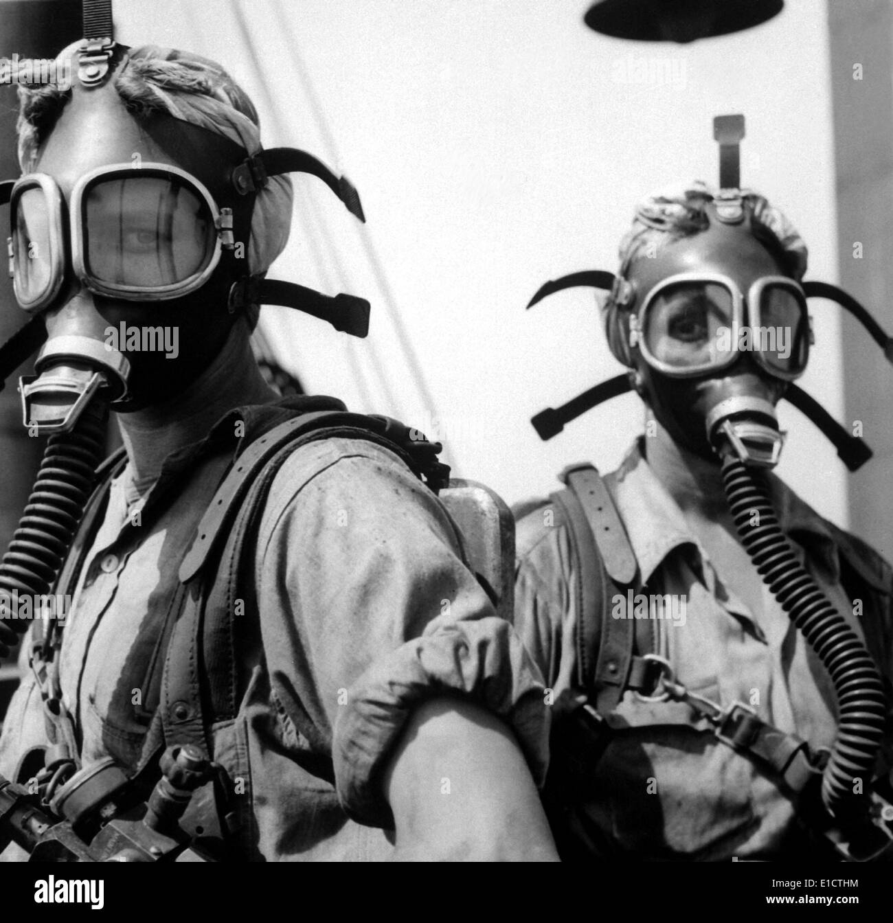 Women war workers wear oxygen masks while cleaning at U.S. Steel Works in Gary, Indiana. Ca