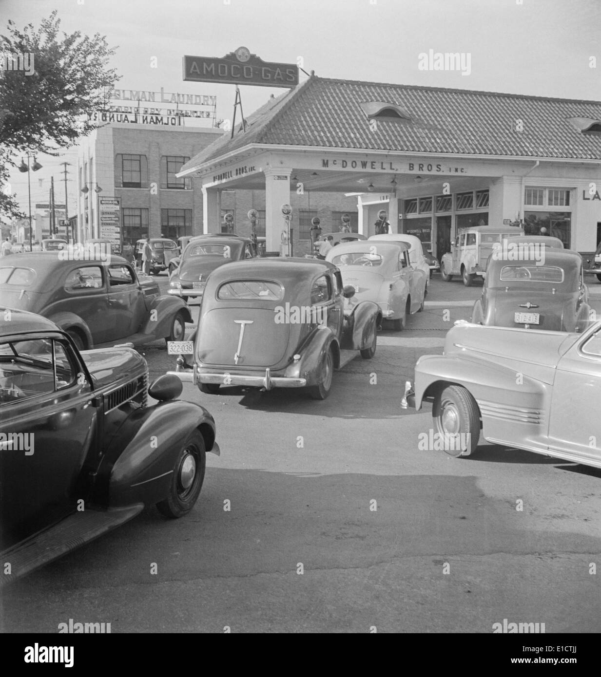 Gasoline lines on June 21, 1942, the day before rationing began during World War 2. Amoco Station on Wisconsin Avenue in Stock Photo