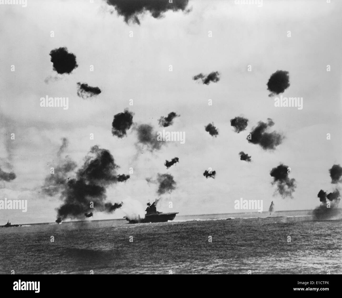American aircraft carrier USS Yorktown hit by a Japanese bomb in the Battle of Midway, June 4, 1942. A torpedo attack later Stock Photo