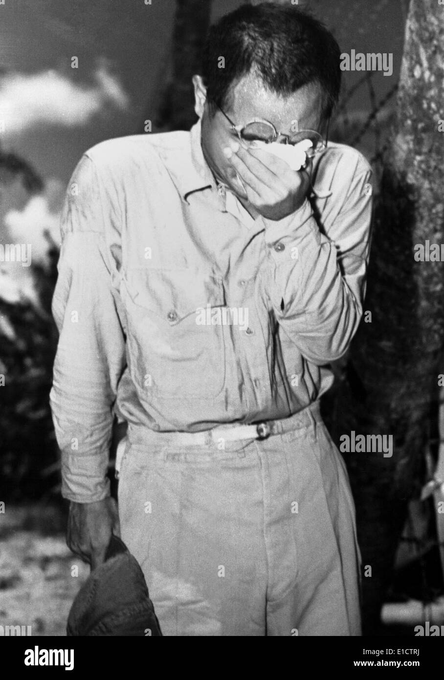 Japanese POW on Guam after hearing Emperor Hirohito announce of Japan's surrender. August 15, 1945, at the end of World War 2. Stock Photo