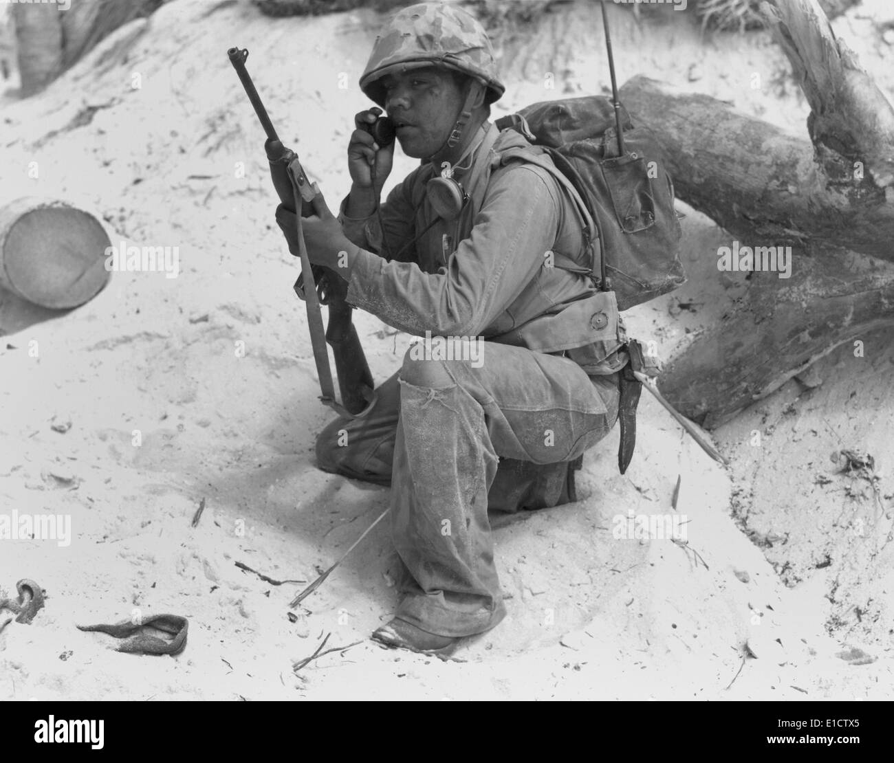 U.S. Marine Native American 'Code Talker' uses walkie-talkie in the South Pacific during World War 2. Nov. 1943. Stock Photo
