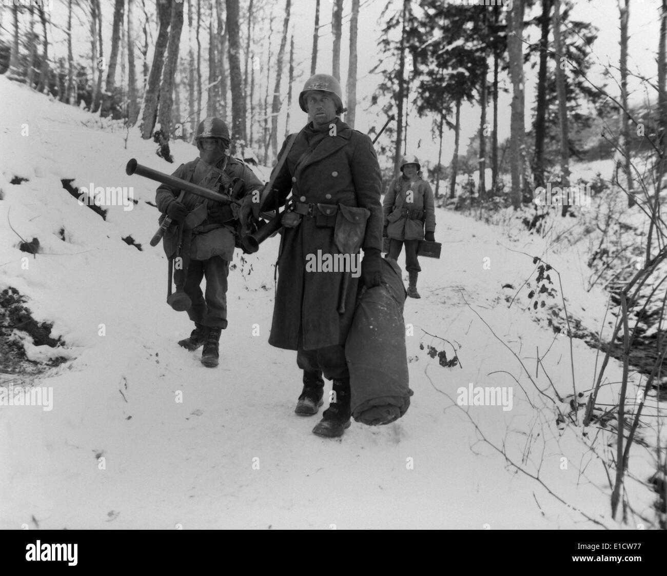 Three soldiers of the U.S. 101st Engineers, held their woodland position all night. They defended it against German counter Stock Photo