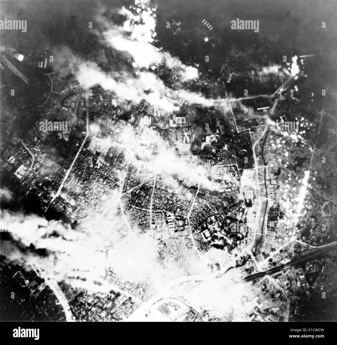 Tokyo burns under B-29 firebomb assault. In this raid, 464 B-29s fire bombed the area immediately south of the Imperial Palace. Stock Photo