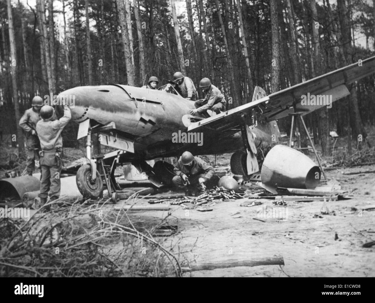 American soldiers, probably engineers, investigate a captured German Jet, the Messerschmitt Me 262. Ca. July-Dec 1945. Stock Photo