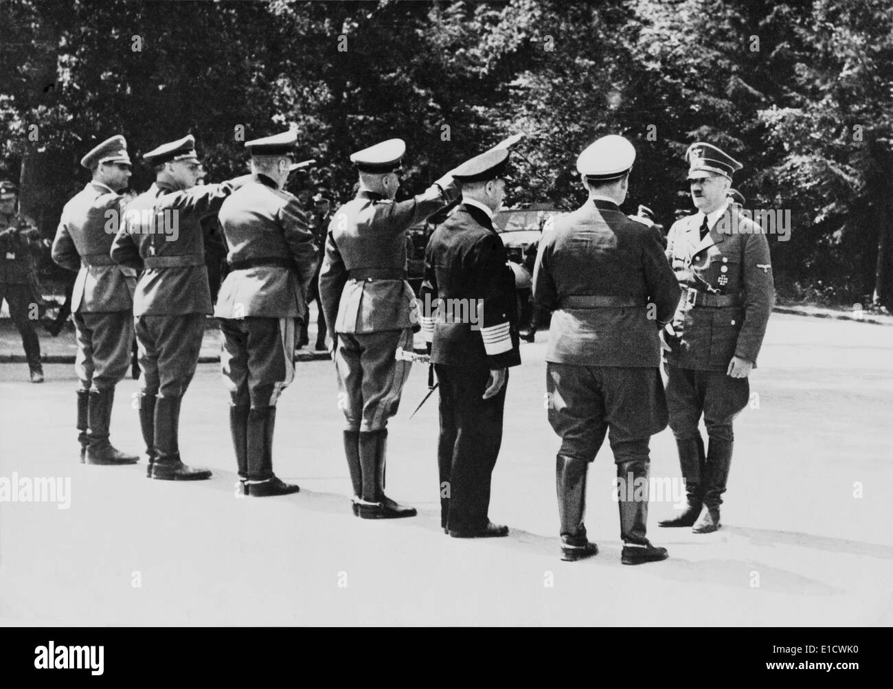 Adolf Hitler arrives at the ceasefire negotiations at Compiegne, France. Those saluting L-R: Rudolf Hess, unidentified, Walther Stock Photo