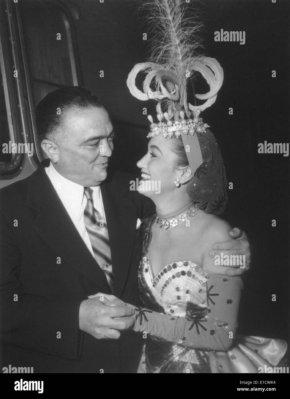 J. Edgar Hoover and actress Dorothy Lamour, looking into each others