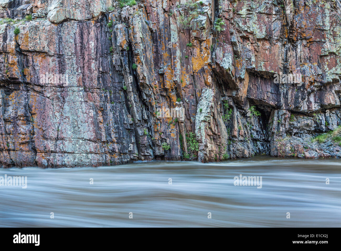rock cliff and whitewater river - Cache la Poudre River at Little Narrows near Fort Collins, Colorado Stock Photo