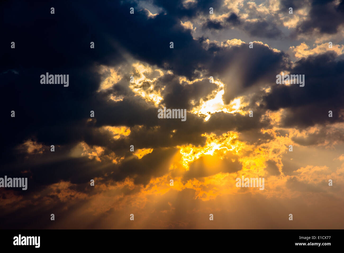 Sunbeam ray light through cloud sky twilight color blue and orange Dramatic background Stock Photo