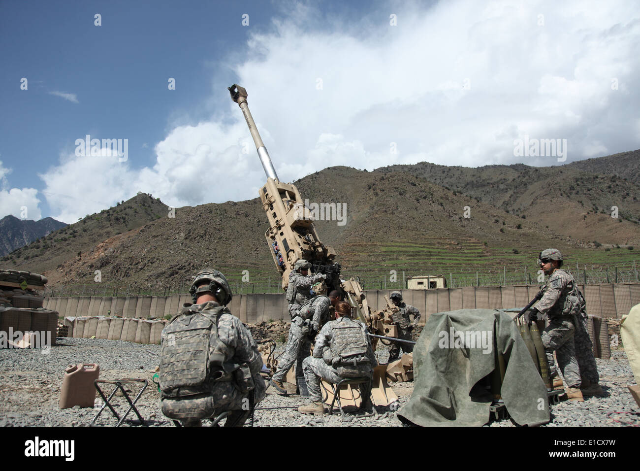 U.S. Soldiers prepare for their next fire mission at Forward Operating Base Bostick, Afghanistan, March 30, 2010. The Soldiers Stock Photo