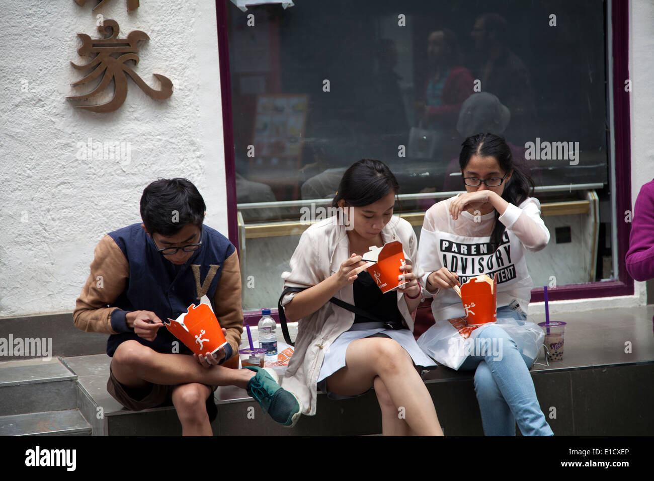 Chinatown Youth Having Takeaways - London Soho - UK Stock Photo