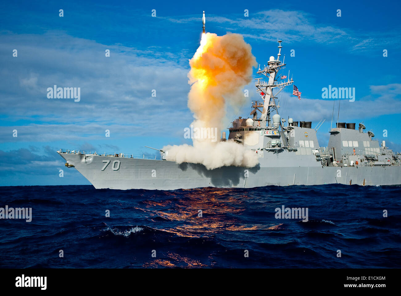 The Arleigh Burke-class guided missile destroyer USS Hopper (DDG 70), equipped with the Aegis integrated weapons system, launch Stock Photo