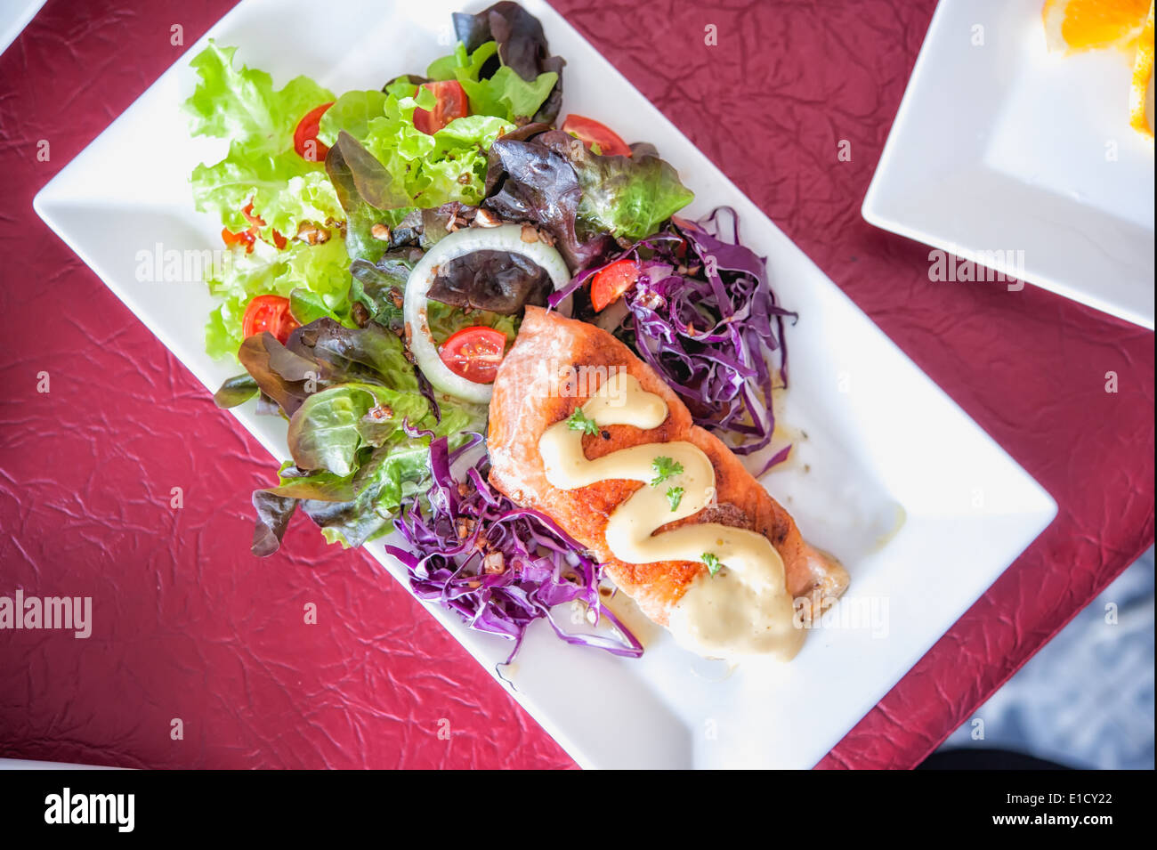 crispy grilled salmon steak with salad on white dish Stock Photo - Alamy