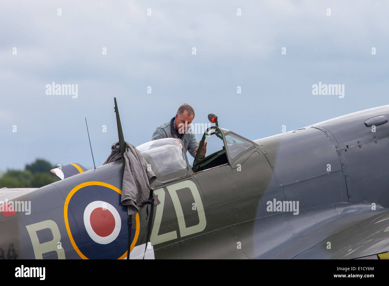 A World War 2 Spitfire being prepared for flight at The Duxford Airshow in Cambridgeshire Stock Photo