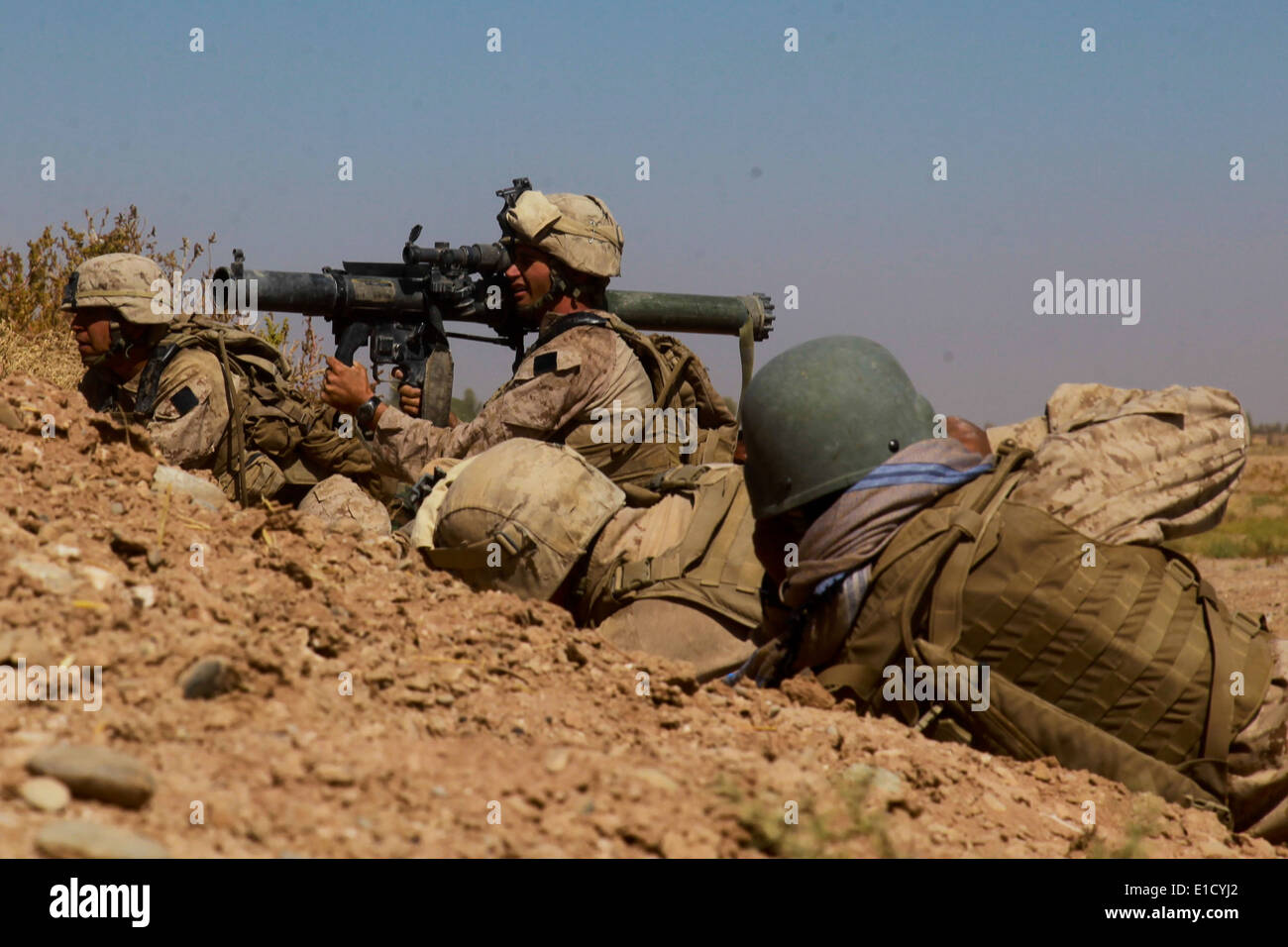 U.S. Marine Corps Lance Cpl. Jordan Christie prepares to fire a shoulder-launched multipurpose assault weapon at a compound in Stock Photo