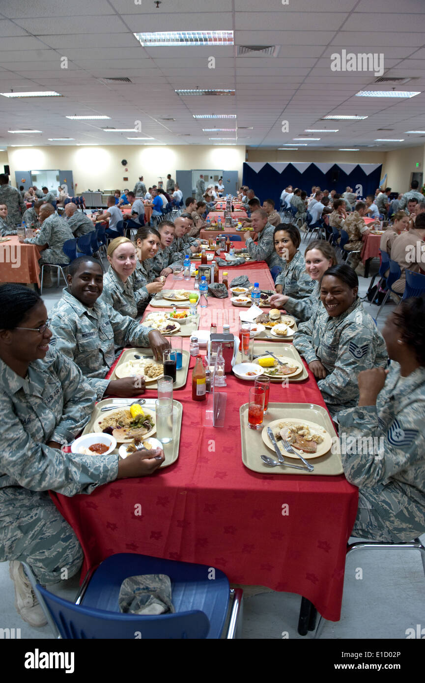 U.S. Airmen gather for a Thanksgiving meal at an undisclosed base in Southwest Asia Nov. 26, 2009. Soldiers, Sailors, Marines, Stock Photo