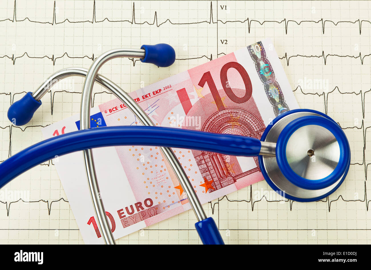 Stethoscope and ten euro banknote. Costs at the doctor. Deductible