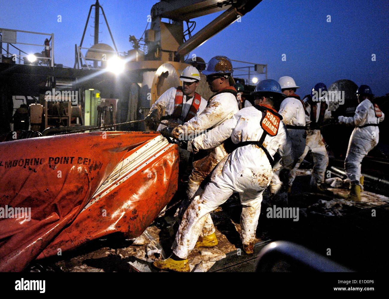 Crewmembers from USCGC Harry Claiborne (WLM 561) remove an oil covered boom from the Gulf of Mexico May 8, 2010. The boom was p Stock Photo