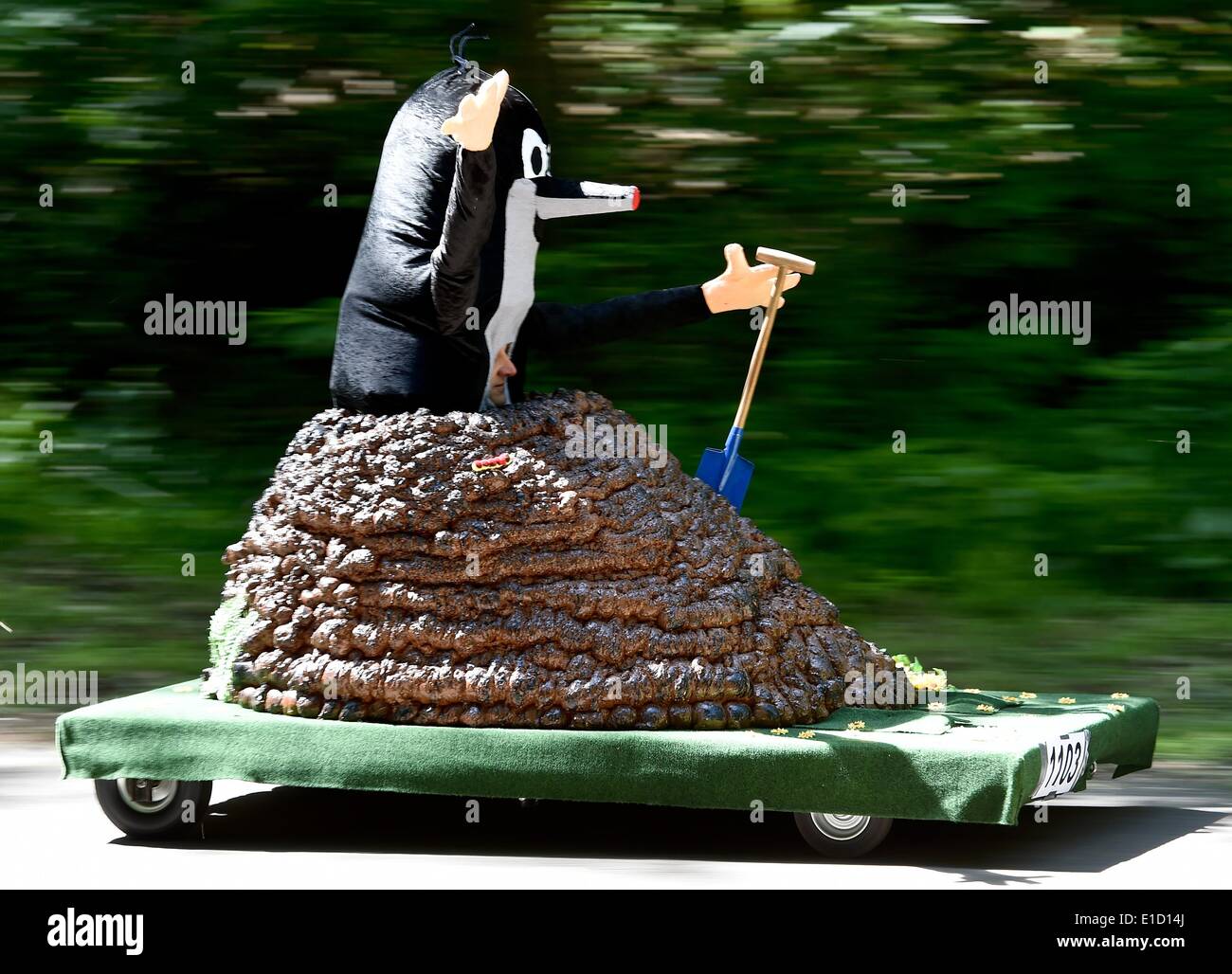 Rauen, Germany. 31st May, 2014. A participant dressed as mole races in his soapbox during the soapbox car race in Rauen, Germany, 31 May 2014. More than fifty participants take part in the gravity racer race. Photo: Patrick Pleul/dpa/Alamy Live News Stock Photo